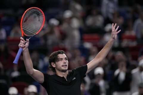 Fritz and Dimitrov finally advance at rain-soaked Shanghai Masters