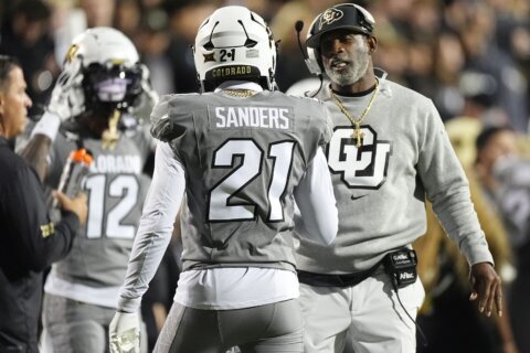 Shedeur Sanders, Travis Hunter help Colorado beat Cincinnati 34-23 to become bowl eligible