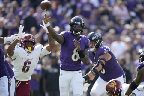 Jackson outduels Daniels and Henry runs for two TDs as Ravens beat Commanders 30-23