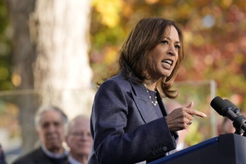 The Latest: Harris keeps a focus on 'blue wall' states in the campaign's final weeks