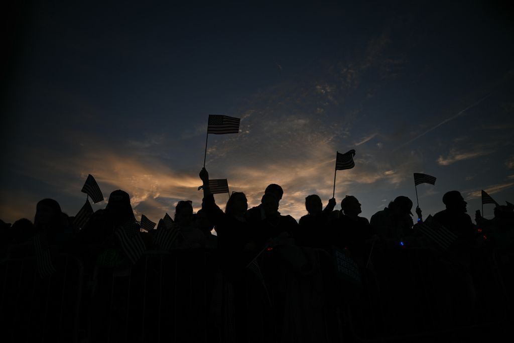 Supporters of US Vice President and Democratic presidential candidate Kamala Harris wait on The Ellipse just south of the White House for her speech in Washington, DC, on October 29, 2024. The Harris-Walz campaign is billing the speech as "a major closing argument" one week before the November 5 election. (Photo by Brendan SMIALOWSKI / AFP) (Photo by BRENDAN SMIALOWSKI/AFP via Getty Images)