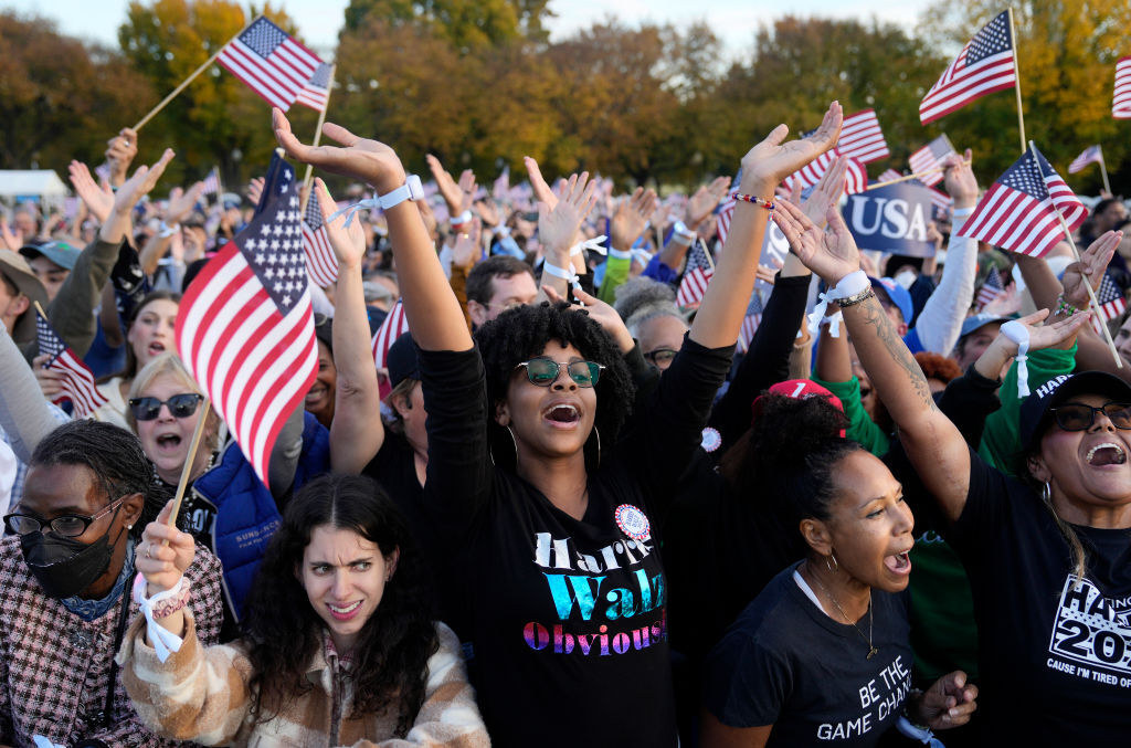 WASHINGTON, DC - OCTOBER 29: Supporters wait for the start of a campaign rally for Democratic presidential nominee U.S. Vice President Kamala Harris on the Ellipse on October 29, 2024 in Washington, DC. With one week remaining before Election Day, Harris will deliver her “closing argument,” a speech where she will outline her plan for America, urging voters to “turn the page” on Republican presidential nominee, former U.S. President Donald Trump. (Photo by Kent Nishimura/Getty Images)