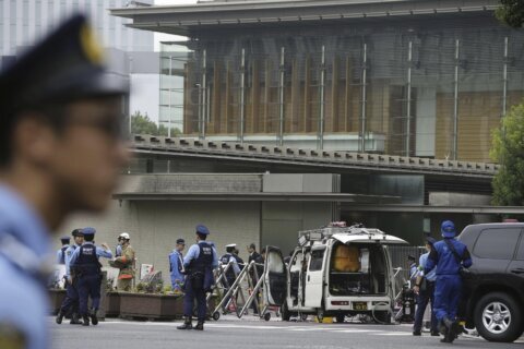 Japan’s governing party headquarters is attacked with firebombs and suspect is arrested