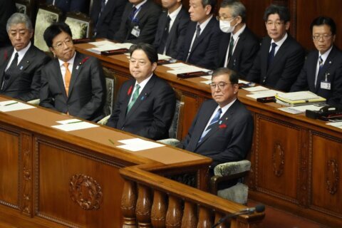 Japan's new PM dissolves the lower house of parliament to set up a snap election