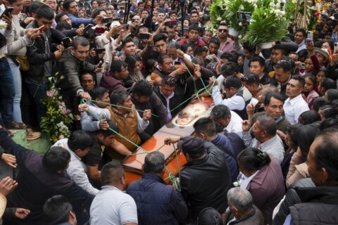 Burial held for Catholic priest and Indigenous peace activist killed in southern Mexico