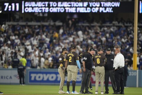 Dodger Stadium fans toss balls and trash on field, interrupt Padres’ 10-2 win that evens NLDS