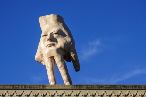 A New Zealand city waves goodbye to its giant hand sculpture that many came to love