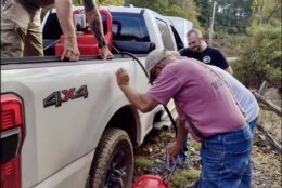 People filling gasoline containers