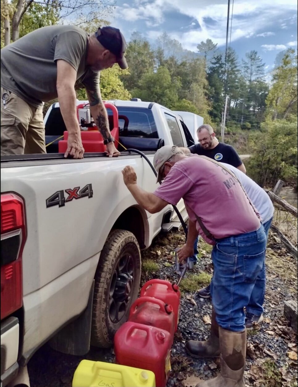 People filling gasoline containers