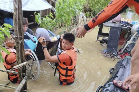 Tropical storm battering Philippines leaves at least 24 people dead in flooding and landslides