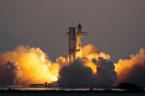 In an engineering feat, mechanical SpaceX arms catch Starship rocket booster back at the launch pad