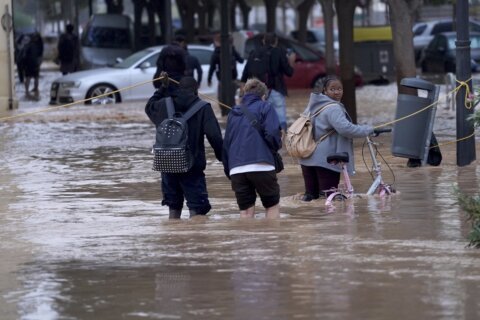 At least 64 people die in devastating flash floods in eastern Spain, officials say