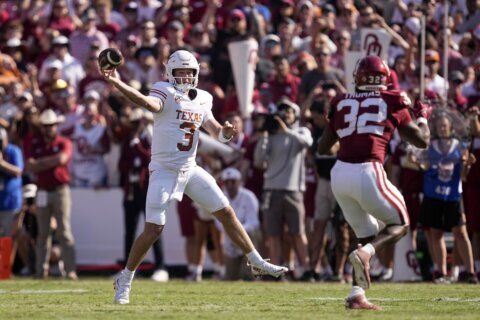 Ewers returns as No. 1 Texas beats No. 18 Oklahoma 34-3 in 1st Red River Rivalry game as SEC members