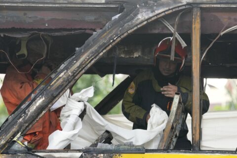 More than 20 are feared dead after a school bus catches fire in suburban Bangkok