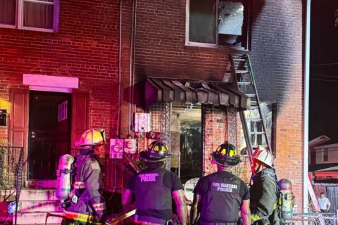 2 dead, 1 fighting to survive, following DC house fire