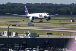 A FedEx cargo plane arrives at Dulles International Airport carrying giant pandas from China on Tuesday, Oct. 15, 2024 in Sterling, Va. (AP Photo/Kevin Wolf)