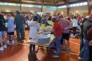 Hundreds of volunteers in McLean pack food for the hungry