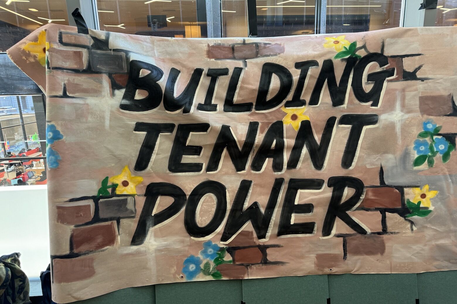 A "Building Tenant Power" sign