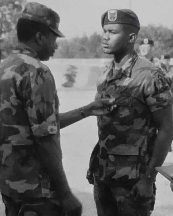 Command Sergent Major Younger pinning The Meritorious Service Medal on his son PFC Collin L Younger Jr.