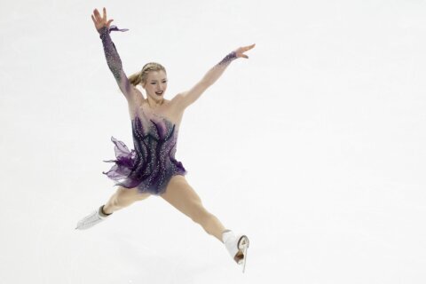 Amber Glenn survives a fall to win her first Grand Prix figure skating title