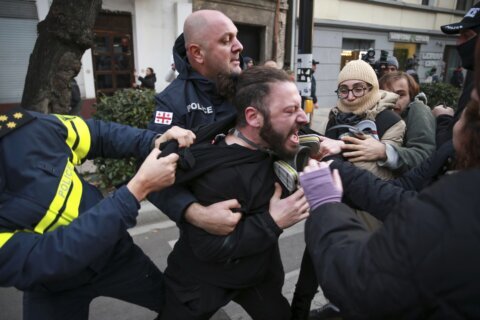 Police in Georgia’s capital break up a tent camp set up by protesters demanding a new election