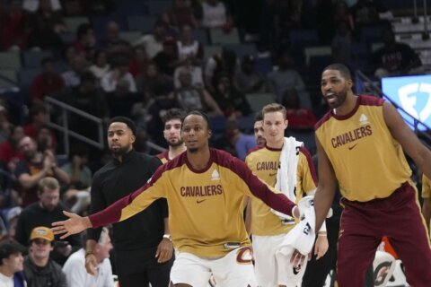 Cavaliers mark historic 9-0 start by getting coach Kenny Atkinson all wet