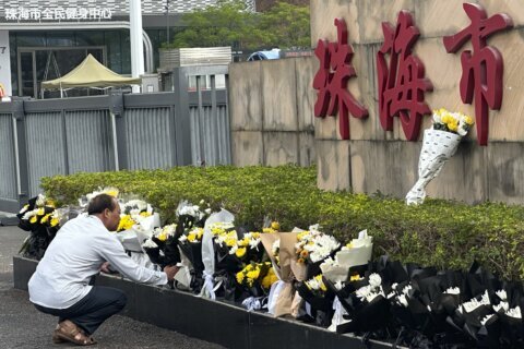 Public mourns 35 killed in attack at sports complex in southern Chinese city