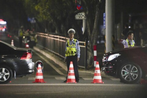 Driver rams his car into crowd in China, killing 35. Police say he was upset about his divorce