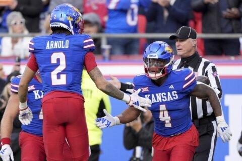 Devin Neal scores 4 times, Kansas beats No. 16 Colorado 37-21 as Buffs’ Big 12 title hopes take hit