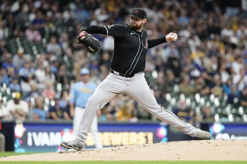 Montgomery exercises $22.5M option with D-backs, Pederson opts out, AP source says