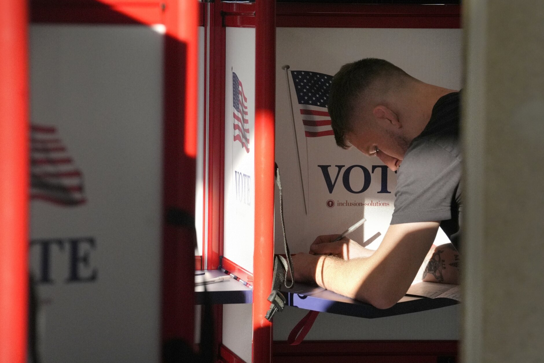 Bomb threats in swing states disrupt a mostly smooth Election Day