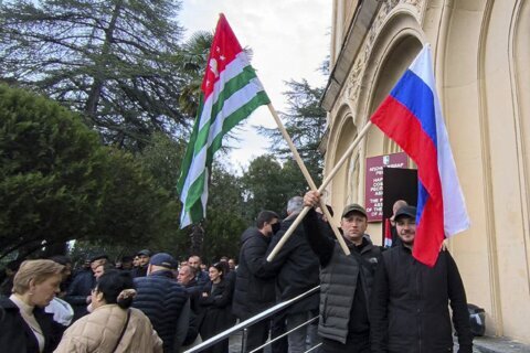 Protesters in separatist Georgian region occupy government buildings, calling for leader’s ouster