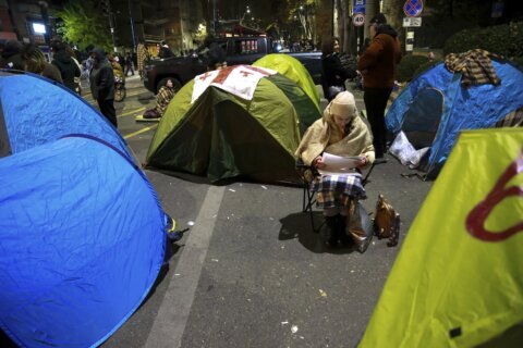 Protesters in Georgia’s capital set up a tent camp on the main street and call for new elections