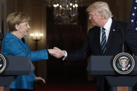 German ex-leader Merkel says she felt sorrow at Trump’s comeback and recalls awkward non-handshake