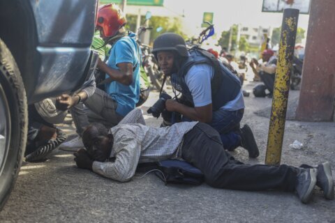 Haiti’s main airport shuts down as gang violence surges and a new prime minister is sworn in