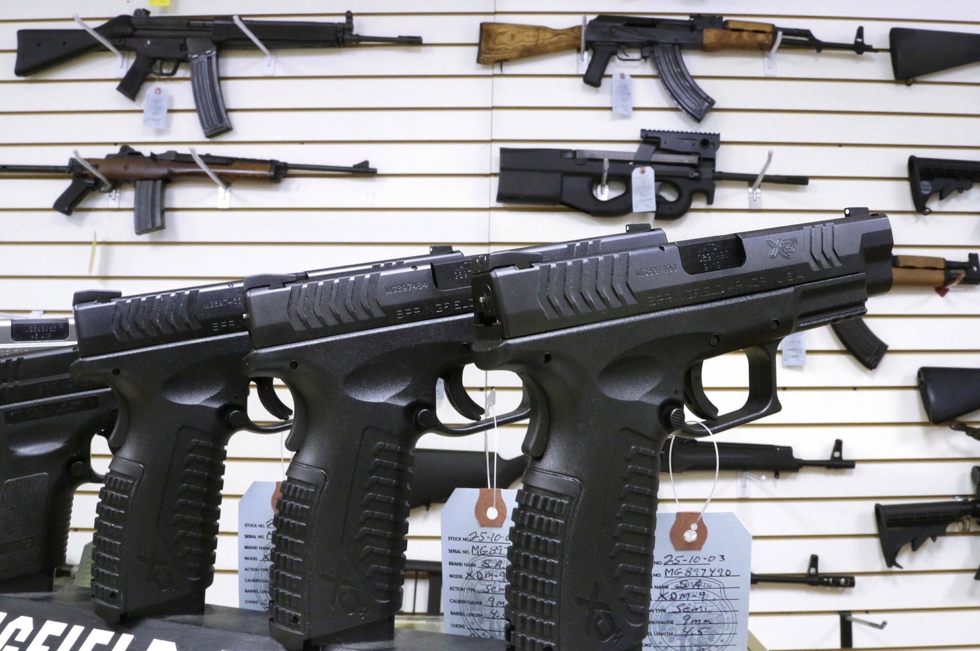Display of assault style weapons and hand guns for sale.