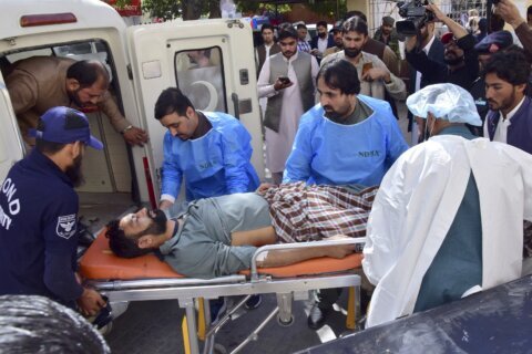 Bomb targeting police assigned for polio drive kills 9 people, including 5 children, in SW Pakistan