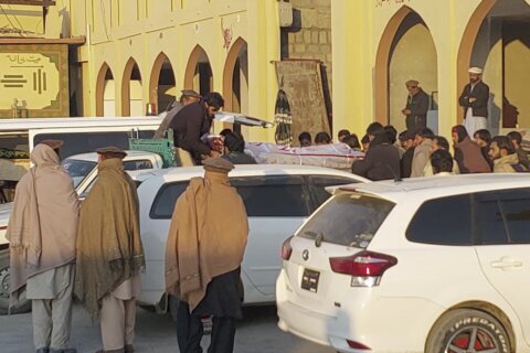 Pakistani city mourns 42 Shiite Muslims who were ambushed and killed in a gun attack