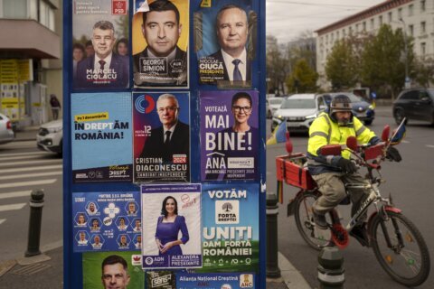 Romanians cast ballots in presidential race that could pit nationalist against leftist in a runoff