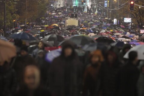 Anti-government protesters blame rampant corruption for roof crash that killed 14 people in Serbia