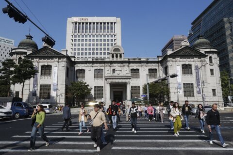 South Korea’s central bank cuts a key rate to nurse a slower economy