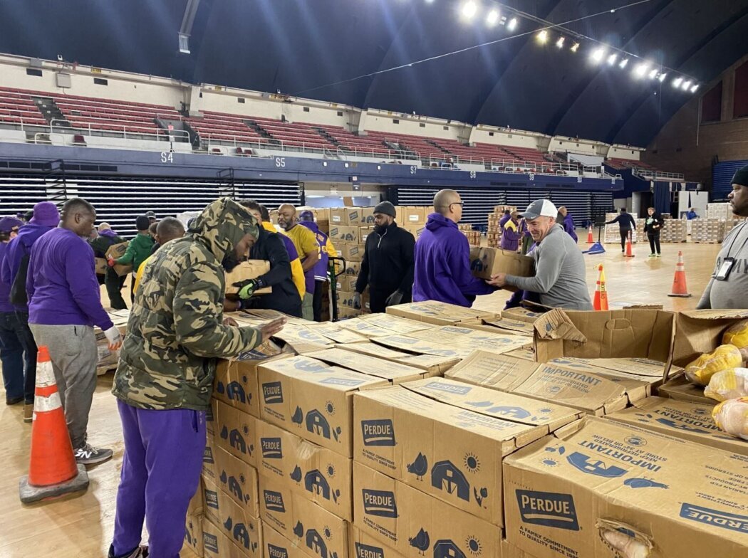 volunteers pack meals