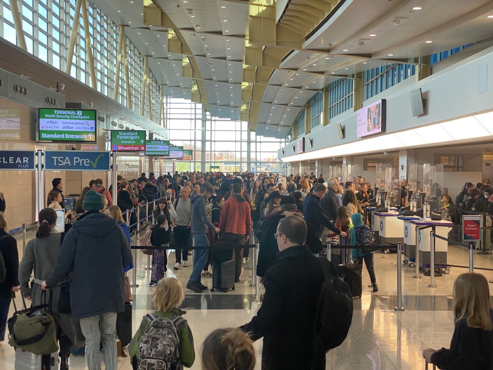 On the day before Thanksgiving, travelers wait in security lines at Reagan Airport on Nov. 27, 2024.