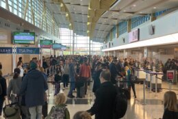 On the day before Thanksgiving, travelers wait in security lines at Reagan Airport on Nov. 27, 2024.