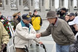 Frank Cohn shakes someone's hand