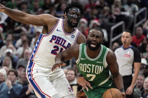 Embiid shakes off pregame fall, leads Sixers to 118-114 win over Celtics