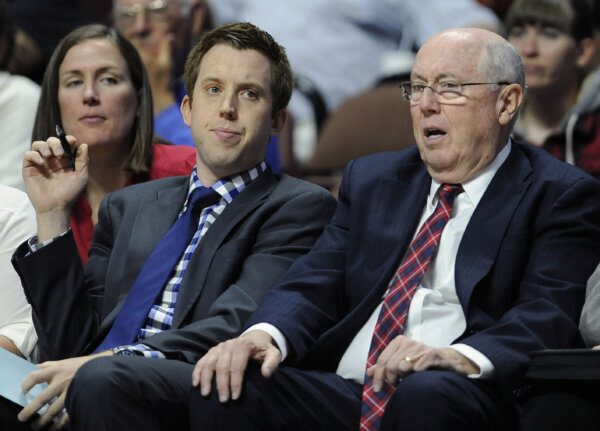 Eric Thibault sitting next to his father Mike Thibault