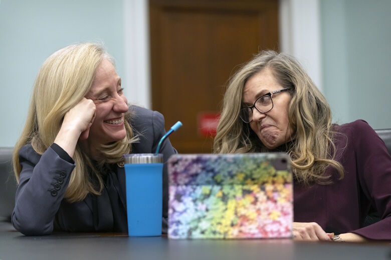 Rep. Abigail Spanberger, D-Va., left, talks with Rep. Jennifer Wexton, D-Va., during an interview with the Associated Press on Capitol Hill, Wednesday, Dec. 4, 2024, in Washington. (AP Photo/Mark Schiefelbein)