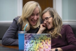 Rep. Abigail Spanberger, D-Va., left, reacts with Rep. Jennifer Wexton, D-Va., during an interview with the Associated Press on Capitol Hill, Wednesday, Dec. 4, 2024, in Washington. (AP Photo/Mark Schiefelbein)