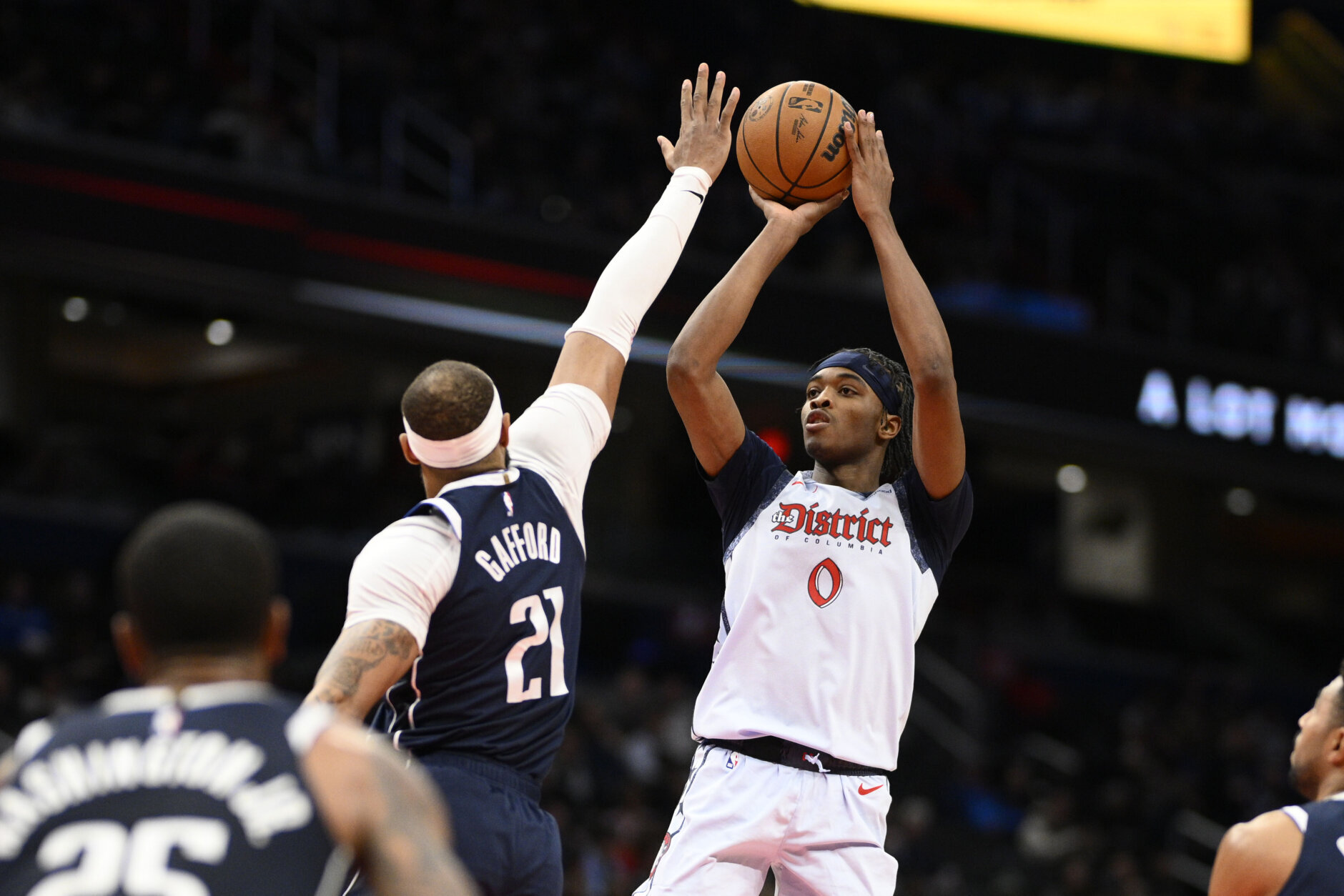 Washington Wizards guard Bilal Coulibaly (0) shoots against Dallas Mavericks center Daniel Gafford (21) during the first half of an NBA basketball game, Thursday, Dec. 5, 2024, in Washington. (AP Photo/Nick Wass)